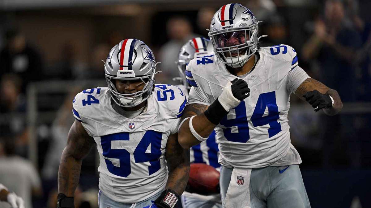 Dallas Cowboys defensive end Marshawn Kneeland (94) and defensive end Sam Williams (54) celebrates after returning a blocked punt for a touchdown during the game between the Dallas Cowboys and the Arizona Cardinals at AT&T Stadium.