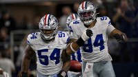 Dallas Cowboys defensive end Marshawn Kneeland (94) and defensive end Sam Williams (54) celebrates after returning a blocked punt for a touchdown during the game between the Dallas Cowboys and the Arizona Cardinals at AT&T Stadium.