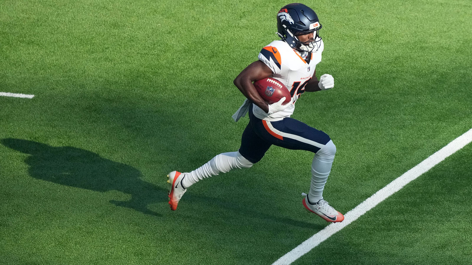 Denver Broncos wide receiver Marvin Mims Jr. (19) carries the ball on a kickoff return in the first quarter against the New York Jets during an NFL International Series game at Tottenham Hotspur Stadium.