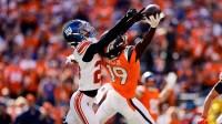 Denver Broncos wide receiver Marvin Mims Jr. (19) is unable to pull in a pass under pressure from New York Giants running back Tyrone Tracy Jr. (29) in the second quarter at Empower Field at Mile High.
