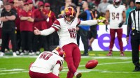 Washington Commanders place kicker Matt Gay (16) kicks a field goal against the Miami Dolphins in the first quarter during the 2025 NFL Madrid Game at Santiago Bernabeu Stadium.