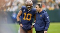 Green Bay Packers head coach Matt LaFleur talks to quarterback Jordan Love (10) during the second half against the Carolina Panthers at Lambeau Field.
