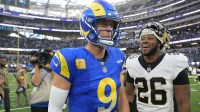 Los Angeles Rams quarterback Matthew Stafford (9) and New Orleans Saints safety Terrell Burgess (26) talk following a game at SoFi Stadium.