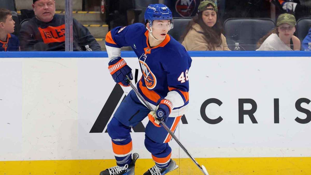 New York Islanders defenseman Matthew Schaefer (48) skates with the puck against the Minnesota Wild during the third period at UBS Arena.