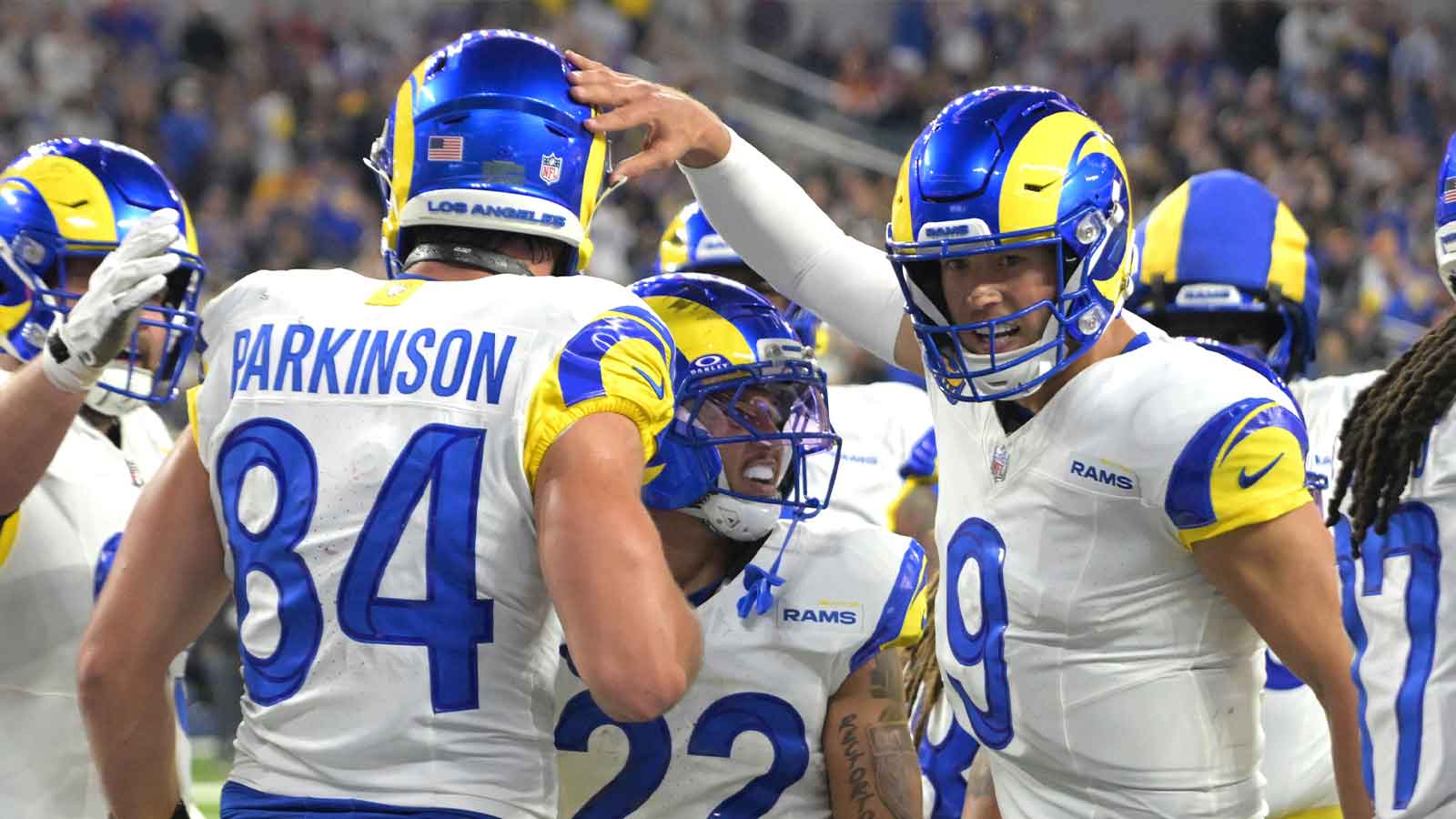 Los Angeles Rams tight end Colby Parkinson (84) is congratulated by quarterback Matthew Stafford (9) after catching a touchdown pass against the Tampa Bay Buccaneers at SoFi Stadium.
