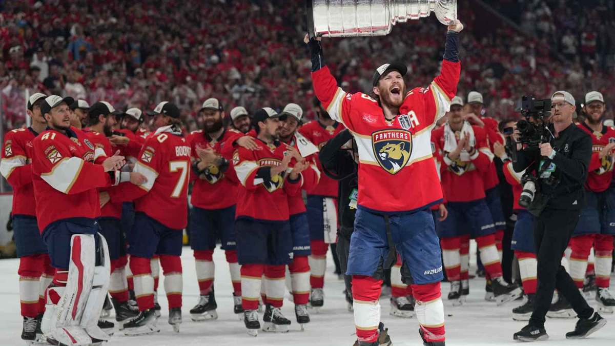 Florida Panthers left wing Matthew Tkachuk (19) hoist the Stanley Cup after game six of the 2025 Stanley Cup Final against the Edmonton Oilers at Amerant Bank Arena.