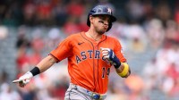 Houston Astros shortstop Mauricio Dubon (14) gestures after hitting a single during the first inning against the Los Angeles Angels at Angel Stadium.