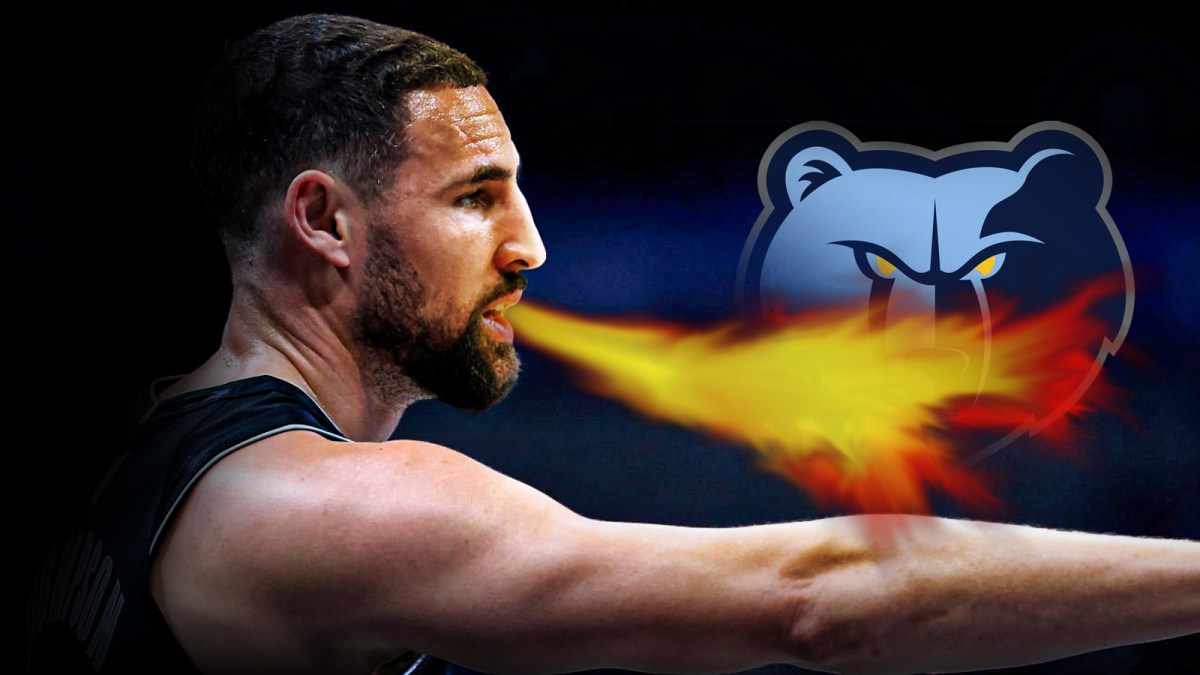 Mavericks Klay Thompson breathing fire at the Grizzlies logo.