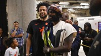 Mavericks' Kyrie Irving poses with Pistons' Cade Cunningham