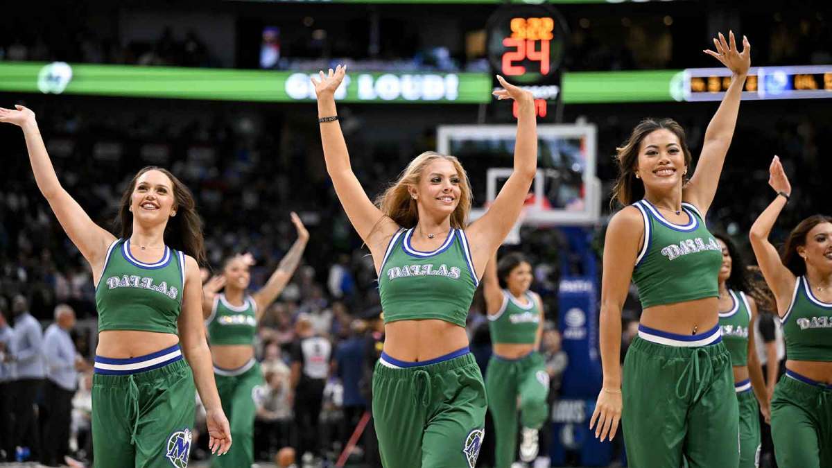 The Dallas Mavericks dancers wave to the fans during the second half of the game against the Oklahoma City Thunder at the American Airlines Center.