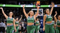 The Dallas Mavericks dancers wave to the fans during the second half of the game against the Oklahoma City Thunder at the American Airlines Center.