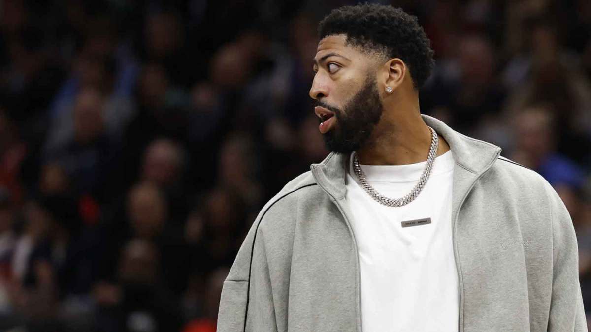Injured Dallas Mavericks forward Anthony Davis looks on from the bench during a timeout against the Washington Wizards in the second half at Capital One Arena.