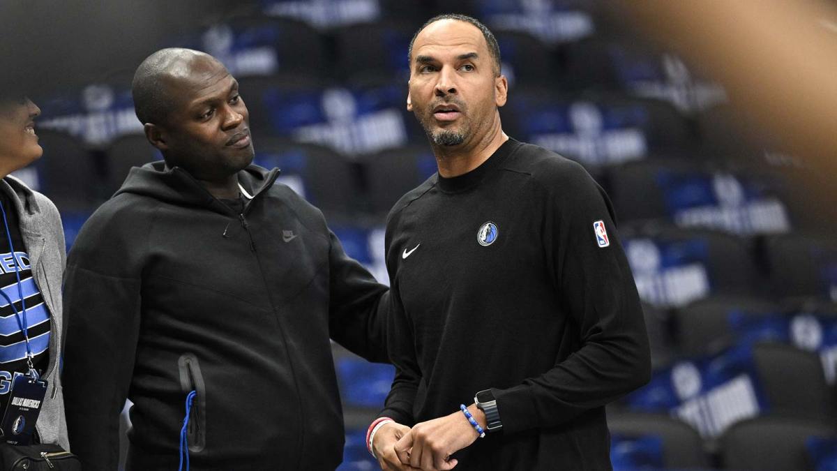 Dallas Mavericks general manager Nico Harrison (right) looks on during warms up before the game between the Dallas Mavericks and the Memphis Grizzlies at the American Airlines Center.