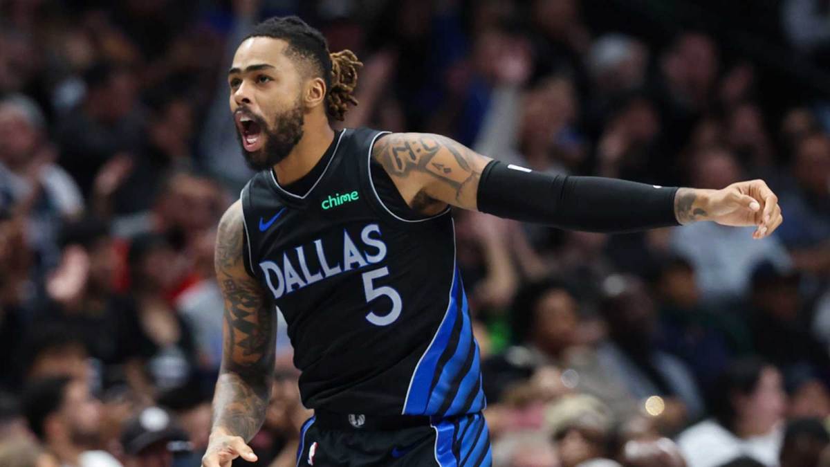 Mavericks guard D'Angelo Russell (5) reacts after scoring during the second half against the Portland Trail Blazers at American Airlines Center with the Pelicans logo in the background