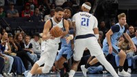 Dallas Mavericks guard Klay Thompson (31) dribbles the ball near a screen set by forward Daniel Gafford (21) against Memphis Grizzlies guard Ja Morant (12) during the second quarter at FedExForum.