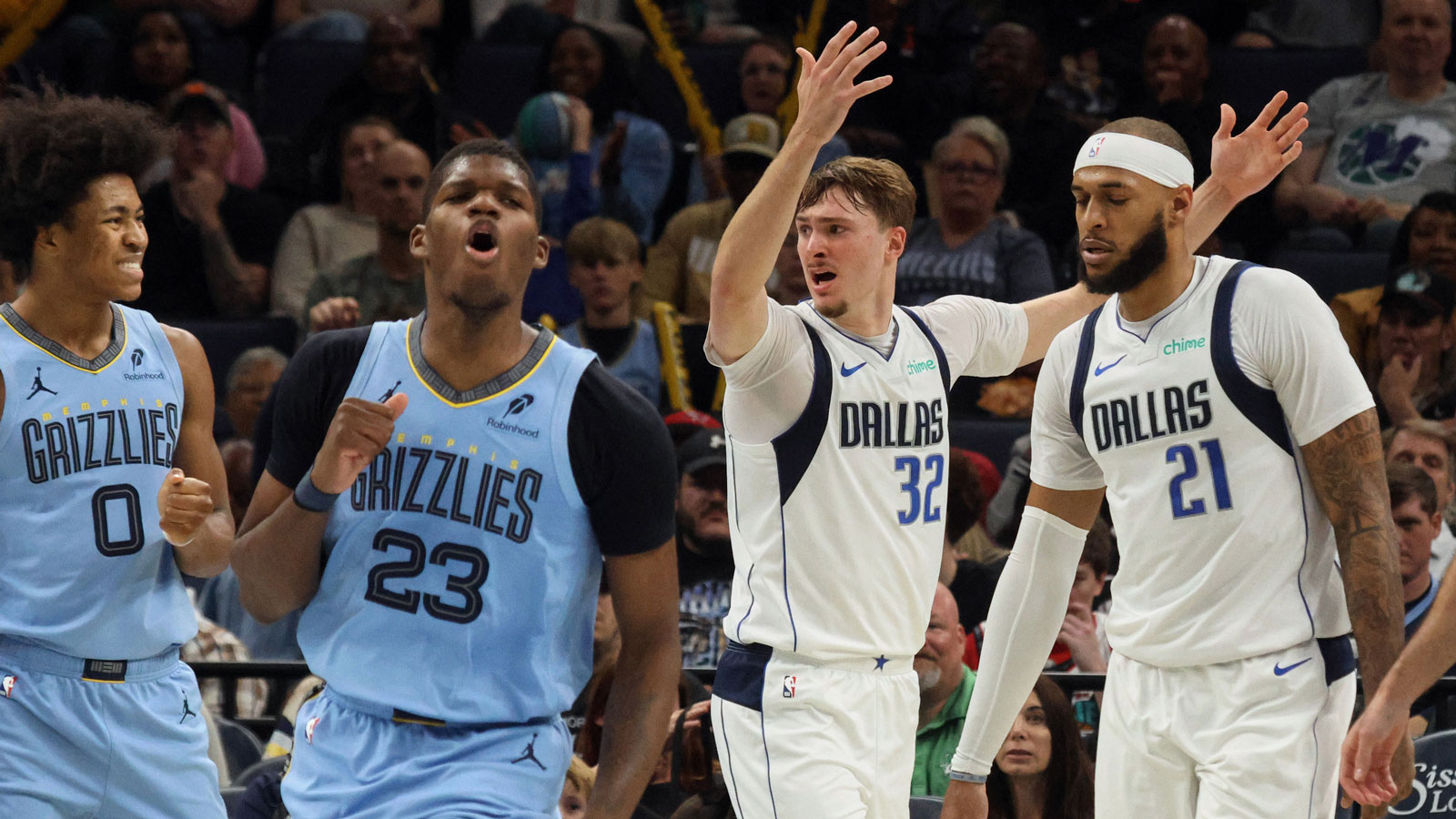 Mavericks forward Cooper Flagg (32) and Memphis Grizzlies forward Cedric Coward (23) react during the second quarter against the Memphis Grizzlies at FedExForum