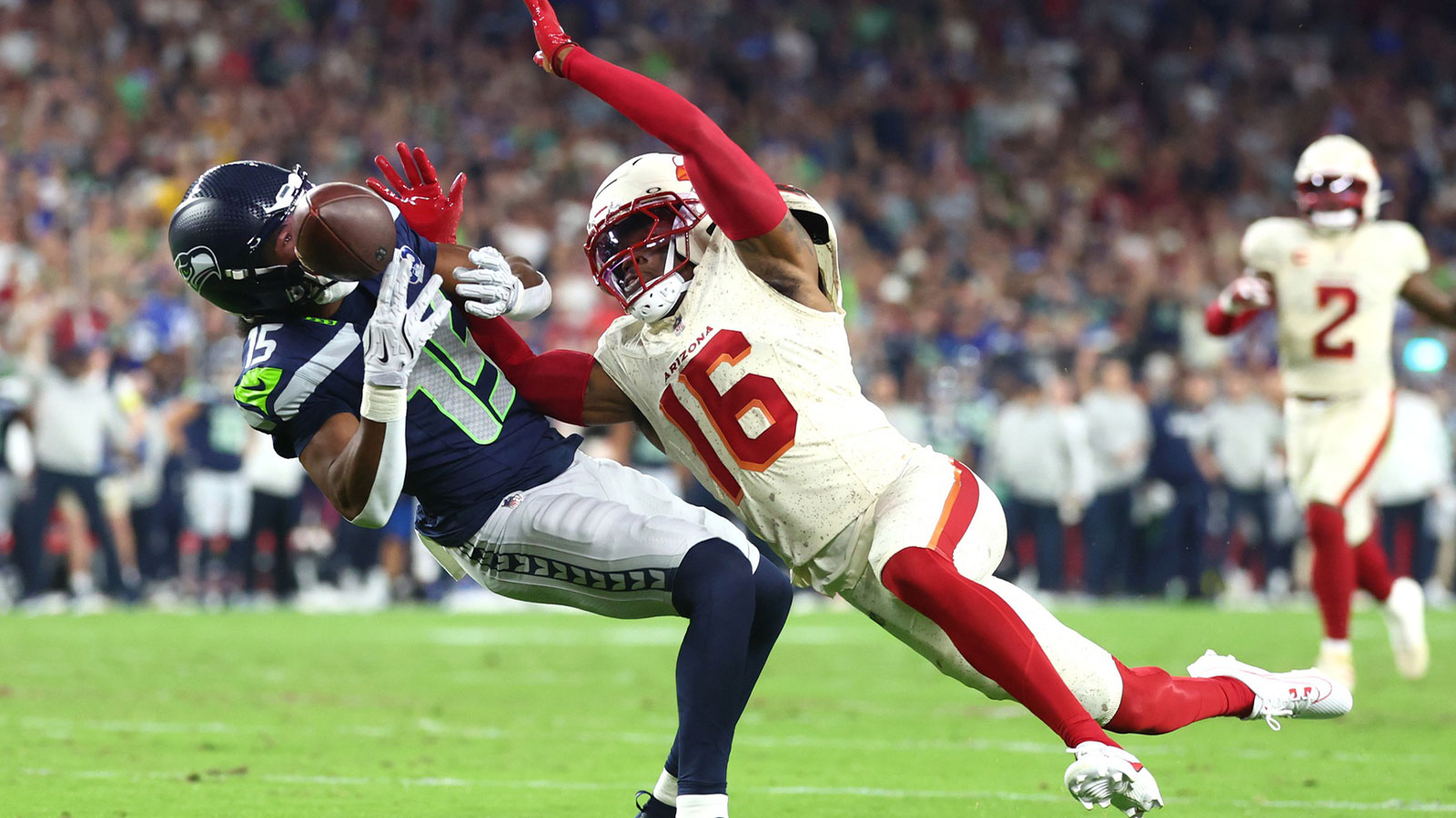 Seattle Seahawks wide receiver Tory Horton (15) cannot make a catch against Arizona Cardinals cornerback Max Melton (16) in the second quarter at State Farm Stadium.