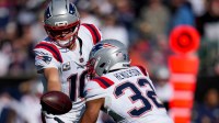 New England Patriots quarterback Drake Maye (10) hands off to running back TreVeyon Henderson (32) in the first quarter against the Cincinnati Bengals at Paycor Stadium.