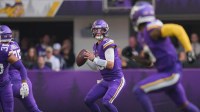 Minnesota Vikings quarterback J.J. McCarthy (9) looks to throw downfield during the first quarter against the Chicago Bears at U.S. Bank Stadium.