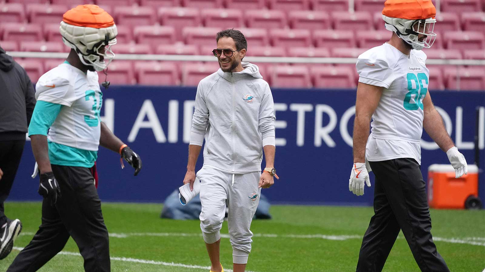 Miami Dolphins head coach Mike McDaniel watches during practice at Estadio Riyadh Air Metropolitano.