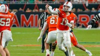 Miami Hurricanes quarterback Carson Beck (11) throws a pass against the Syracuse Orange during the third quarter at Hard Rock Stadium.
