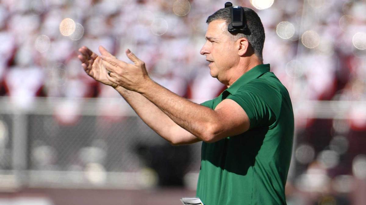 Hurricanes head coach Mario Cristobal signals for his team during the second quarter against the Virginia Tech Hokies at Lane Stadium.