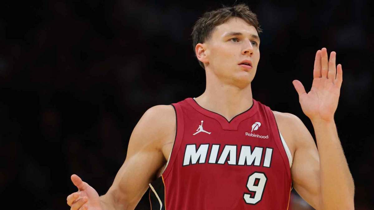 Miami Heat guard Pelle Larsson (9) reacts after scoring against the Charlotte Hornets during the first quarter of an NBA Cup game at Kaseya Center.