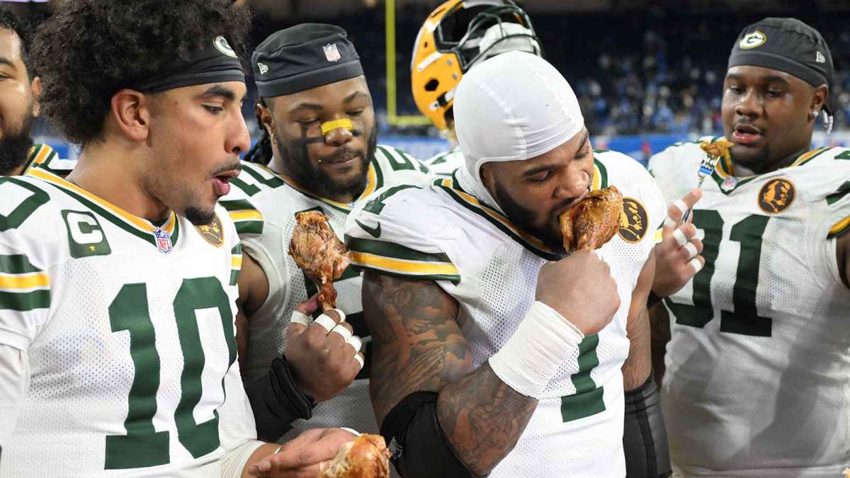 Green Bay Packers quarterback Jordan Love (10), Green Bay Packers defensive end Micah Parsons (1) and Green Bay Packers defensive tackle Warren Brinson (91) eat turkey after defeating the Detroit Lions at Ford Field.