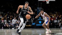 Nov 2, 2025; Brooklyn, New York, USA; Brooklyn Nets forward Michael Porter Jr. (17) leads a fast break as Philadelphia 76ers guard VJ Edgecombe (77) pursues during the second half at Barclays Center. Mandatory Credit: John Jones-Imagn Images