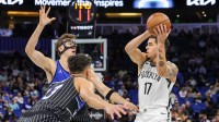Brooklyn Nets forward Michael Porter Jr. (17) looks to pass in front of Orlando Magic forward Franz Wagner (22) during the first quarter at Kia Center.