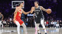 Brooklyn Nets forward Michael Porter Jr. (17) looks to drive past Atlanta Hawks forward Zaccharie Risacher (10) in the second quarter at Barclays Center.