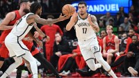 Brooklyn Nets forward Michael Porter Jr. (17) takes the ball from center Nic Claxton (33) in the second half against the Toronto Raptors at Scotiabank Arena.