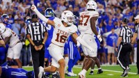 Texas Longhorns defensive back Michael Taaffe (16) celebrates after the Kentucky Wildcats fail to score during overtime at Kroger Field.