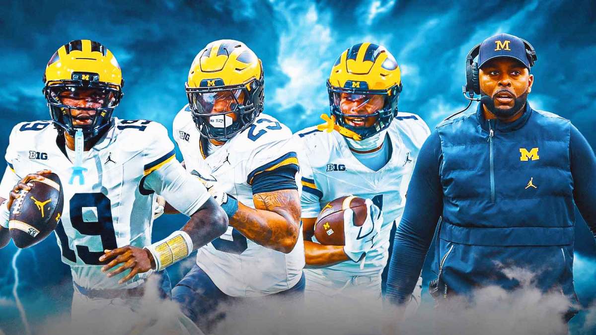 Bryce Underwood, Jordan Marshall, Donaven McCulley, coach Sherrone Moore, Dark clouds in the background