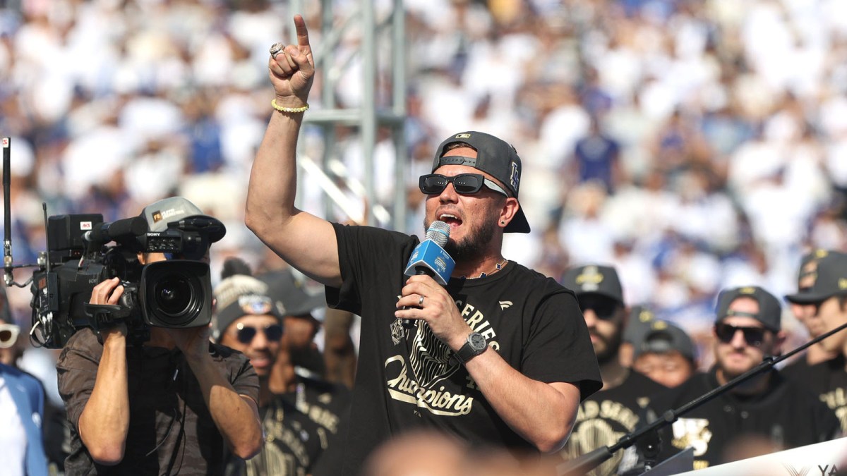 Dodgers player and Game 7 hero Miguel Rojas addresses the crowd during the 2025 World Series championship celebration at Dodger Stadium in Los Angeles on Monday, Nov. 3, 2025.