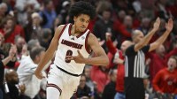 Louisville Cardinals guard Mikel Brown Jr. (0) reacts after making a three pointer against the Kentucky Wildcats during the first half at KFC Yum! Center.