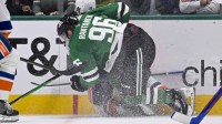 Dallas Stars right wing Mikko Rantanen (96) is called for a game misconduct penalty for boarding on New York Islanders defenseman Alexander Romanov (28) during the third period at the American Airlines Center
