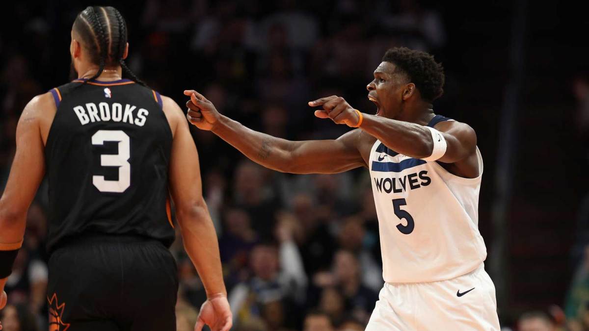 Minnesota Timberwolves guard Anthony Edwards (5) reacts after making a shot against Phoenix Suns forward Dillon Brooks (5) in the second half of an NBA Cup game at Mortgage Matchup Center. Mandatory Credit: Mark J. Rebilas-Imagn Images