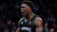 Minnesota Timberwolves guard Anthony Edwards (5) celebrates his basket against the San Antonio Spurs during the second half at Target Center.