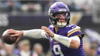 Minnesota Vikings quarterback J.J. McCarthy (9) throws a pass against the Baltimore Ravens during the first quarter at U.S. Bank Stadium.