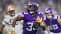 Minnesota Vikings running back Aaron Jones (33) runs with the ball against Green Bay Packers in the third quarter at U.S. Bank Stadium.