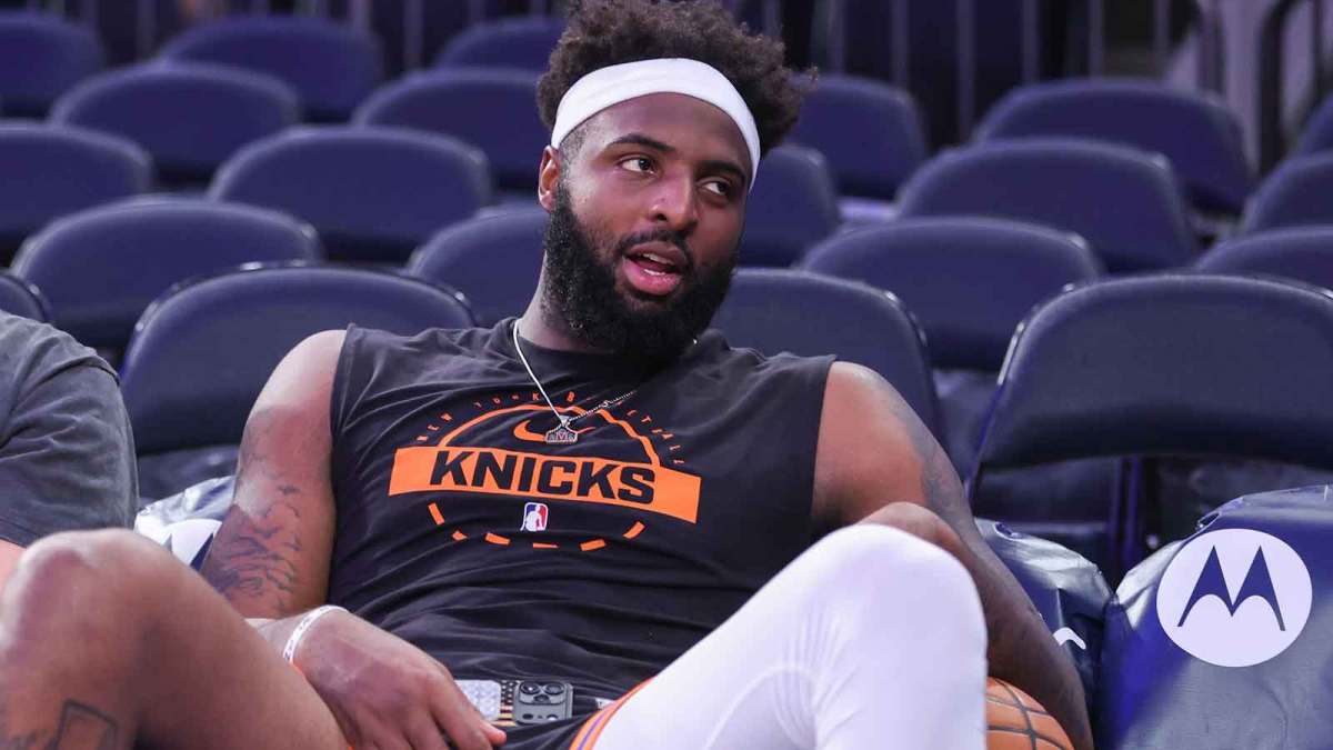 New York Knicks center Mitchell Robinson (23) sits courtside during pregame warmups prior to the game against the Brooklyn Nets at Madison Square Garden.