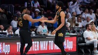 Cleveland Cavaliers center Jarrett Allen (31) high-fives guard Donovan Mitchell (45) in the fourth quarter against the Miami Heat during game three for the first round of the 2025 NBA Playoffs at Kaseya Center.