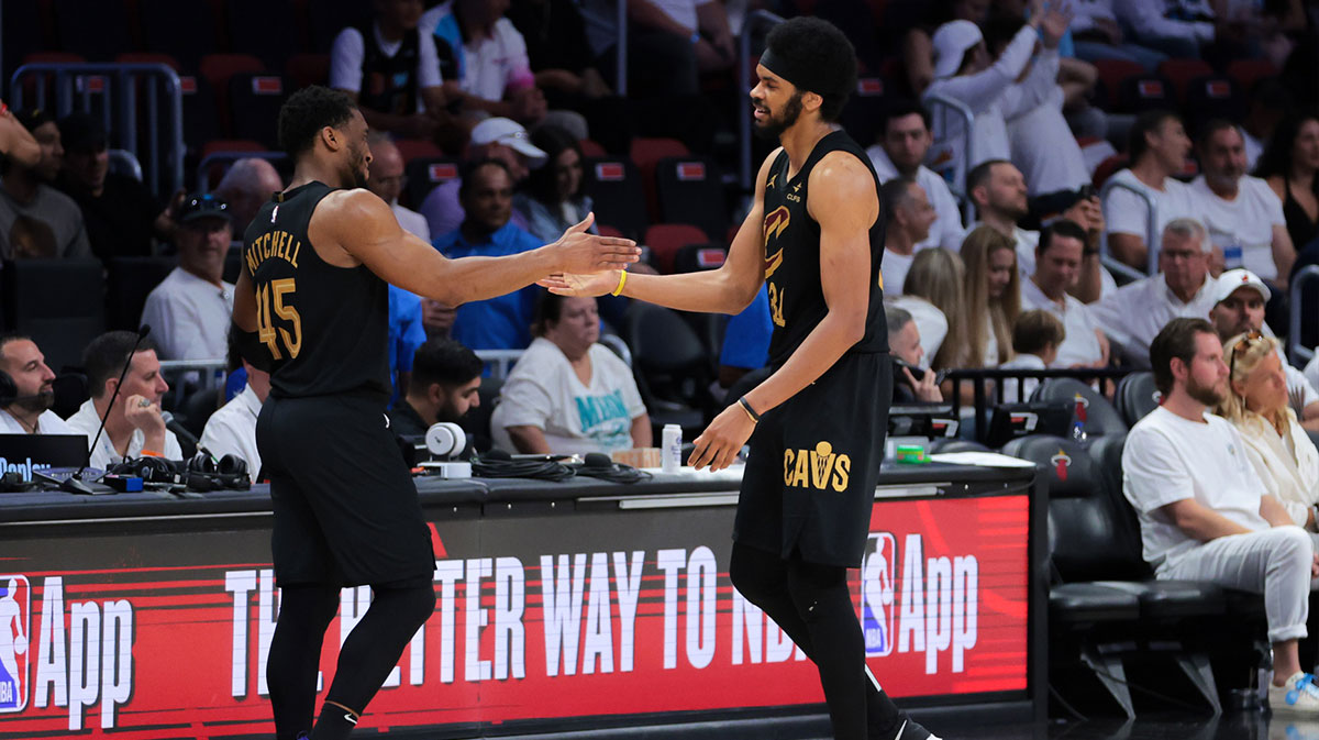 Cleveland Cavaliers center Jarrett Allen (31) high-fives guard Donovan Mitchell (45) in the fourth quarter against the Miami Heat during game three for the first round of the 2025 NBA Playoffs at Kaseya Center.