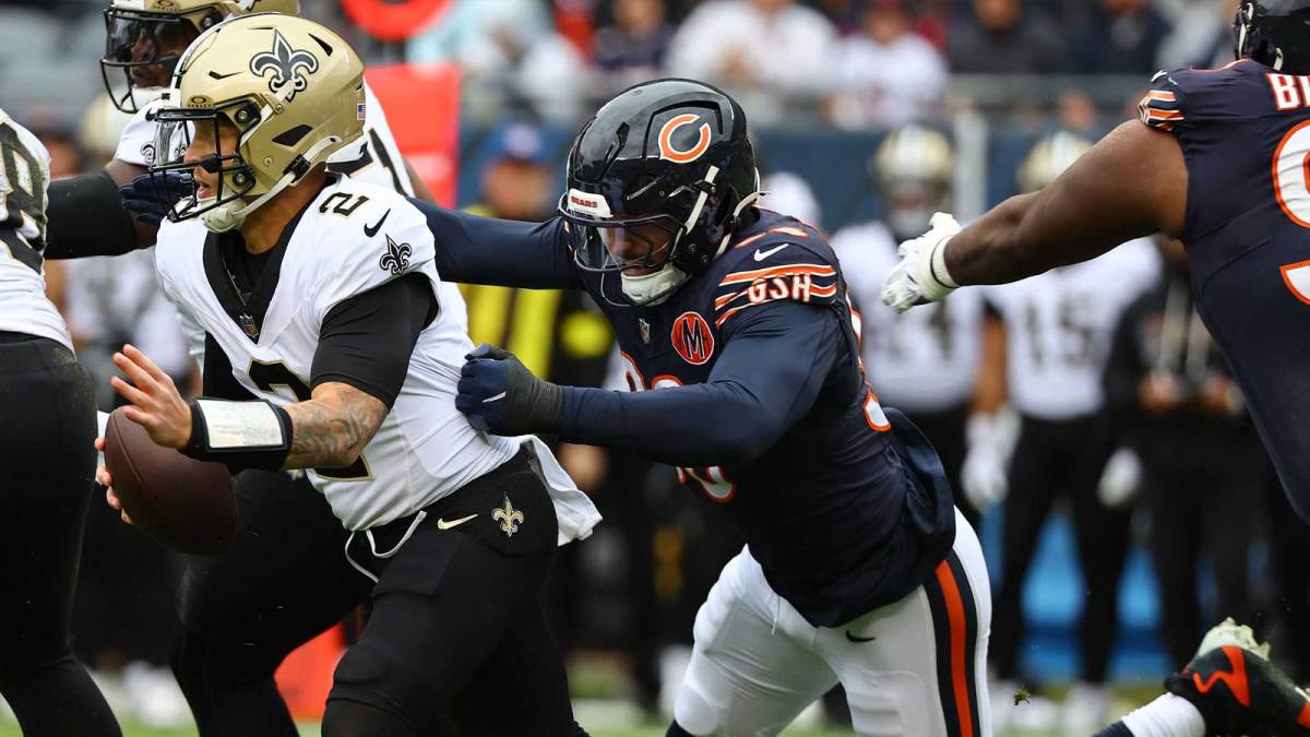 ; Chicago, Illinois, USA; Chicago Bears defensive end Montez Sweat (98) tackles New Orleans Saints quarterback Spencer Rattler (2) during the first quarter at Soldier Field.