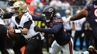 ; Chicago, Illinois, USA; Chicago Bears defensive end Montez Sweat (98) tackles New Orleans Saints quarterback Spencer Rattler (2) during the first quarter at Soldier Field.