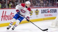 Montreal Canadiens defenseman Adam Engstrom (42) skates with the puck in the first period against the Ottawa Senators at the Canadian Tire Centre