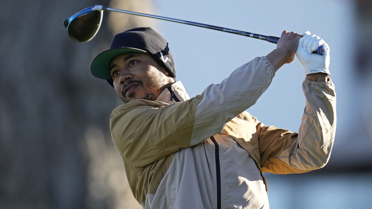 Mookie Betts plays his shot from the first tee during the first round of the AT&T Pebble Beach Pro-Am golf tournament at Monterey Peninsula Country Club - Shore Course.