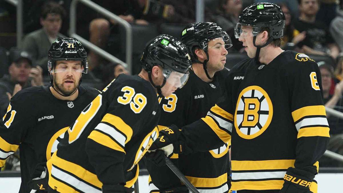 the Boston Bruins celebrate a goal by center Morgan Geekie (39) during the first period against the Washington Capitals at TD Garden.