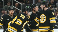 the Boston Bruins celebrate a goal by center Morgan Geekie (39) during the first period against the Washington Capitals at TD Garden.